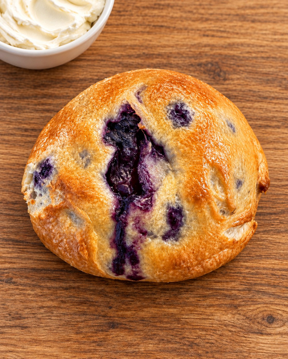 Blueberry bagel with cream cheese at the top